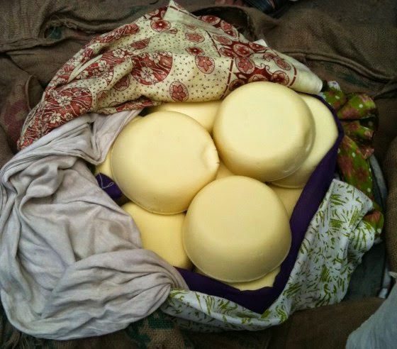 Khoya ''cakes'' wrapped in sarees and dupatta(s) in old Delhi's Khoya Market (Photo Courtesy : eatanddust)
